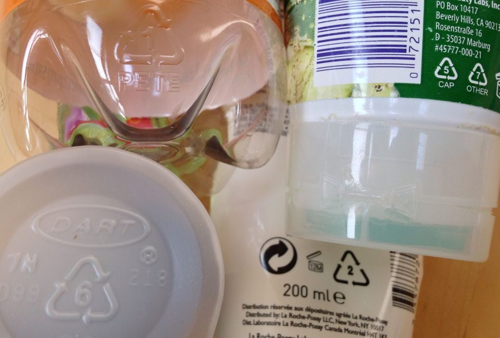 Examples of plastic recycling codes. Each number is for a different kind of plastic.