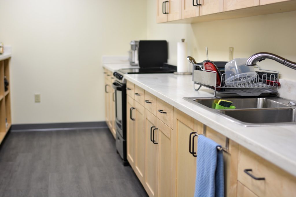 Our expansion included employee amenities, with a renovated kitchen, a coffee area with a Keurig, and updated bathrooms. Everyone deserves a place to relax!