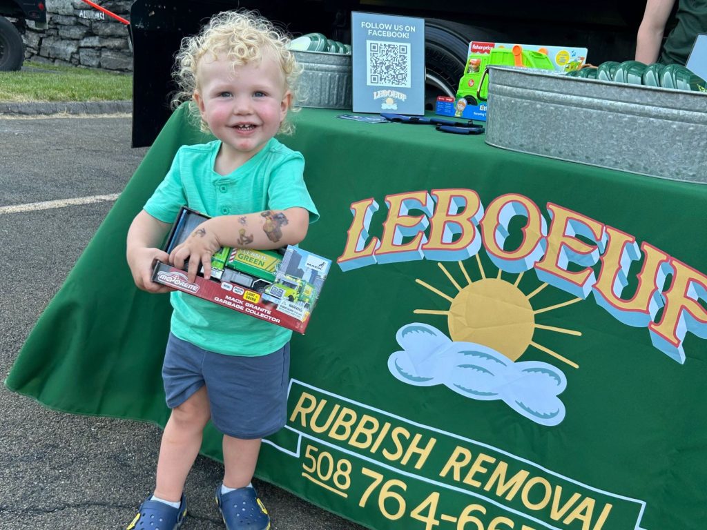 We raffled off a garbage truck, recycling truck, and stuffed Mack dog. Here’s one of the lucky winners who was very excited to get their prize! It’s not every day you get to touch a truck and bring it home with you.