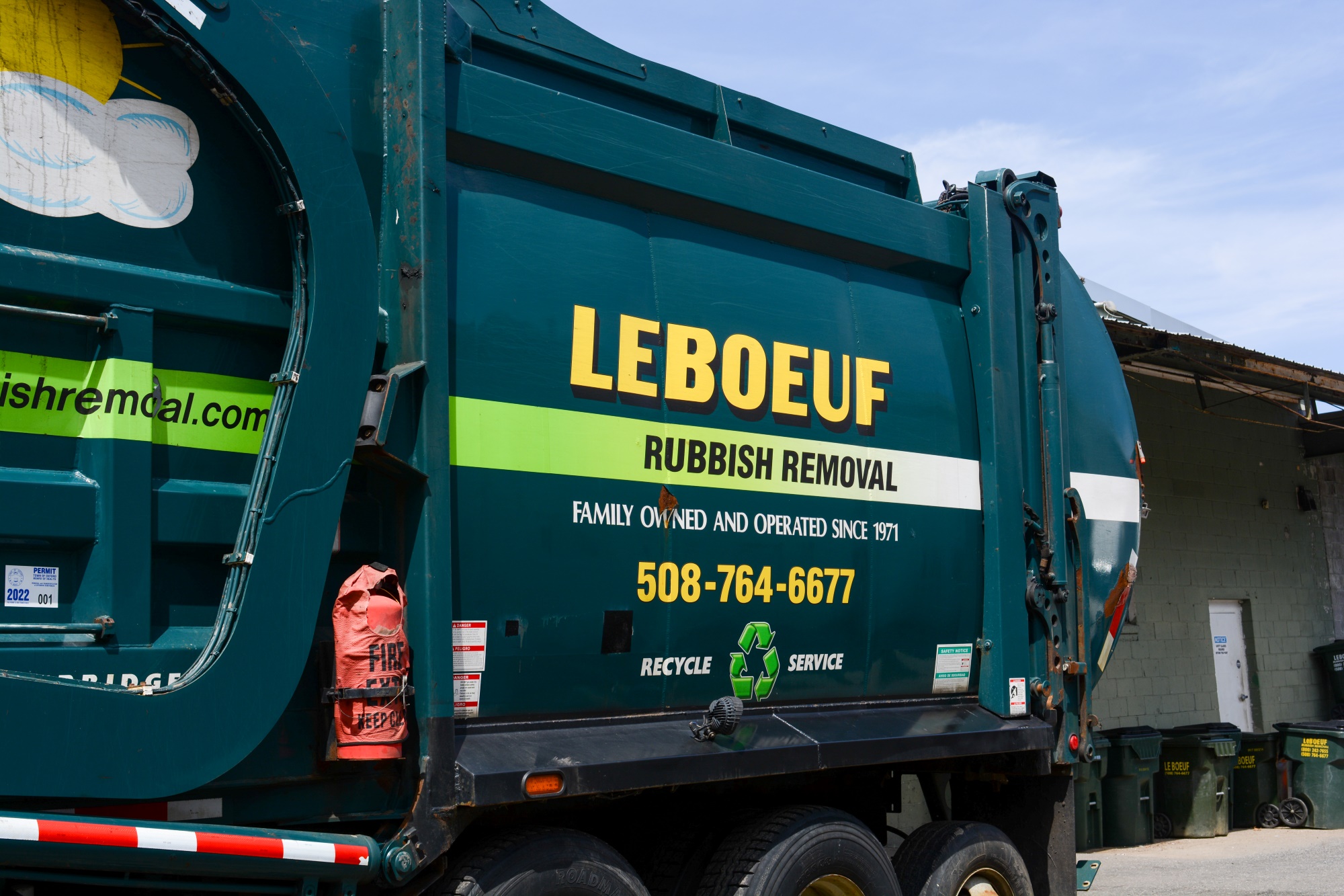 Closeup of the side of a LeBoeuf Rubbish Removal recycling truck.