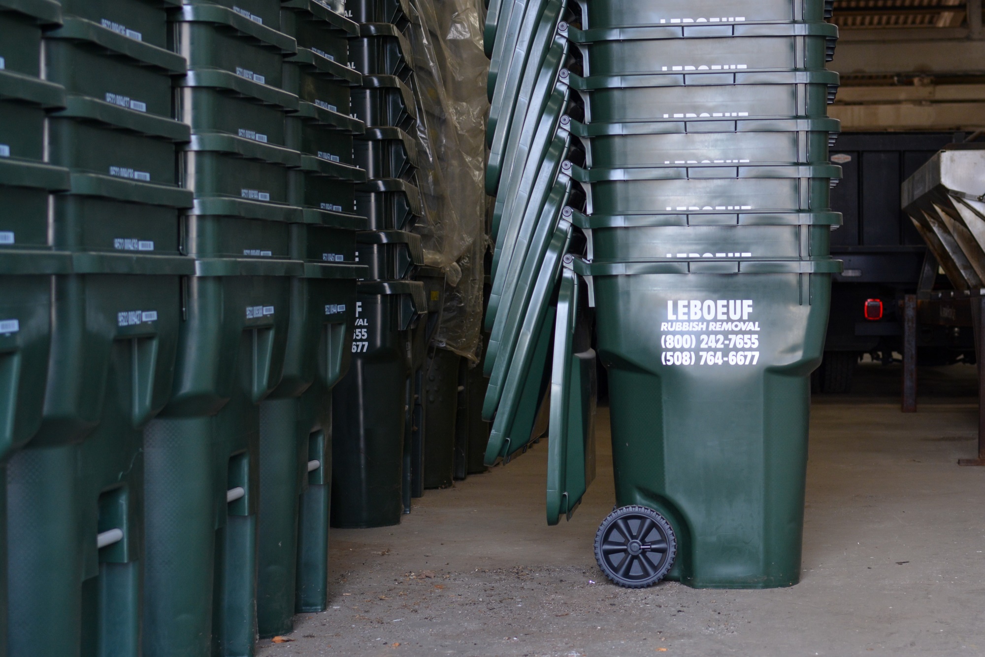 LeBoeuf Rubbish Removal carts stacked in storage, awaiting use.