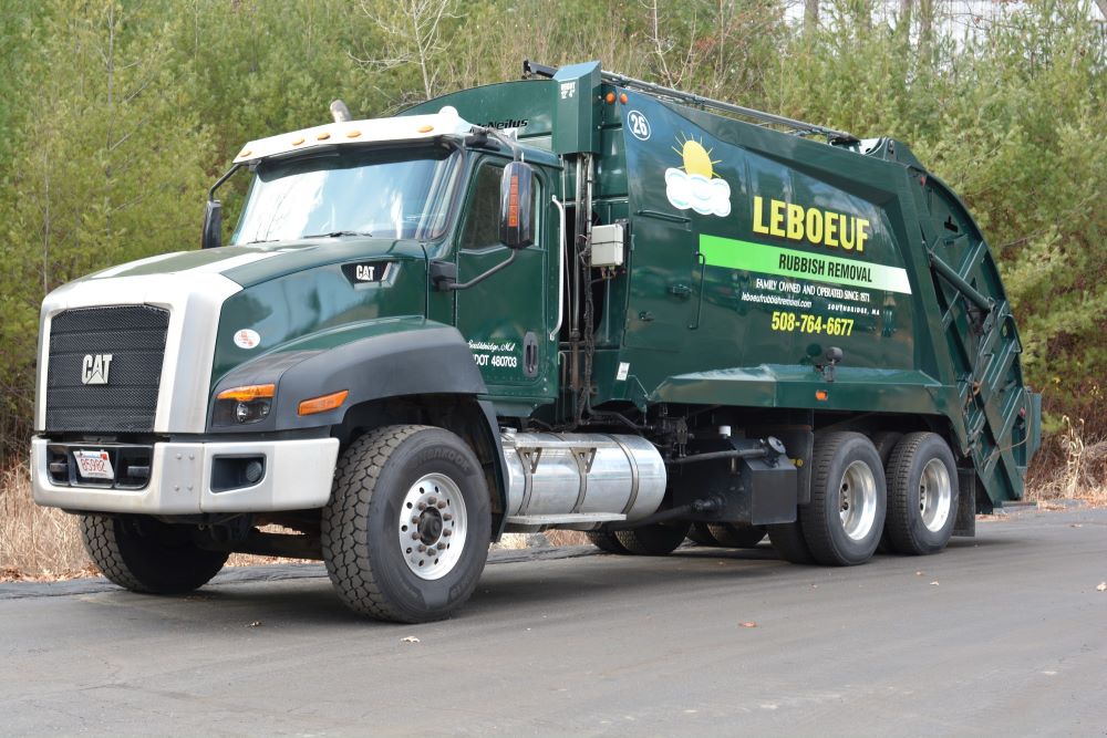 This image shows the LeBoeuf garbage truck parked.